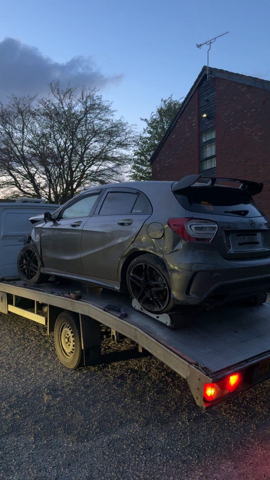 Damaged Mercedes A-Class loaded on recovery flatbed